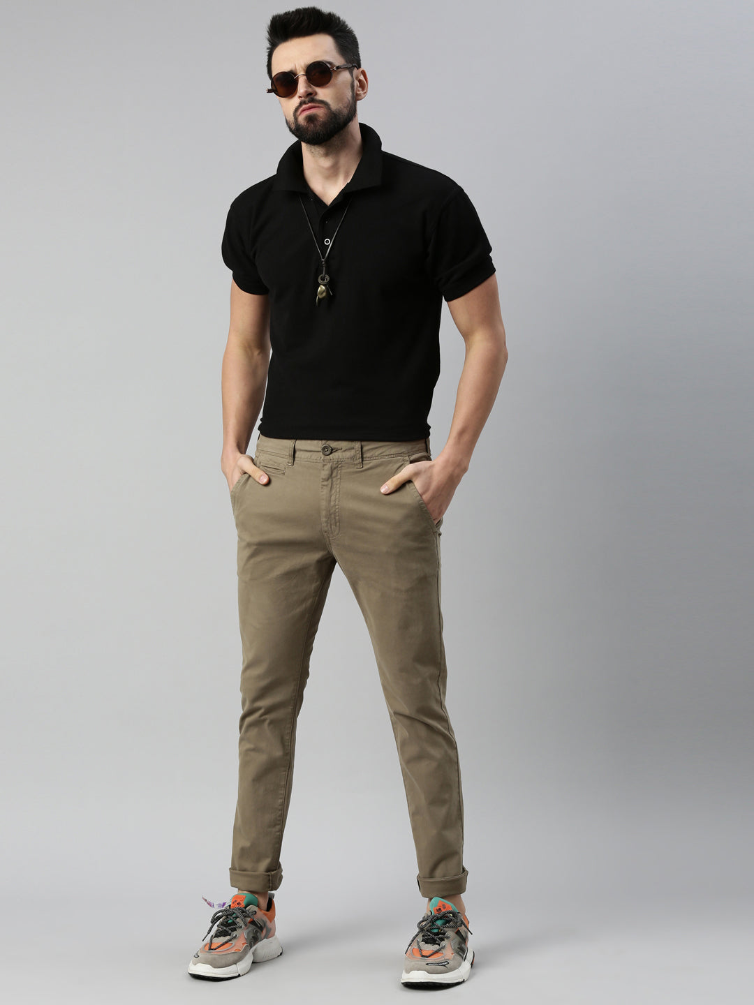 A Man in Black Shirt and Brown Pants · Free Stock Photo